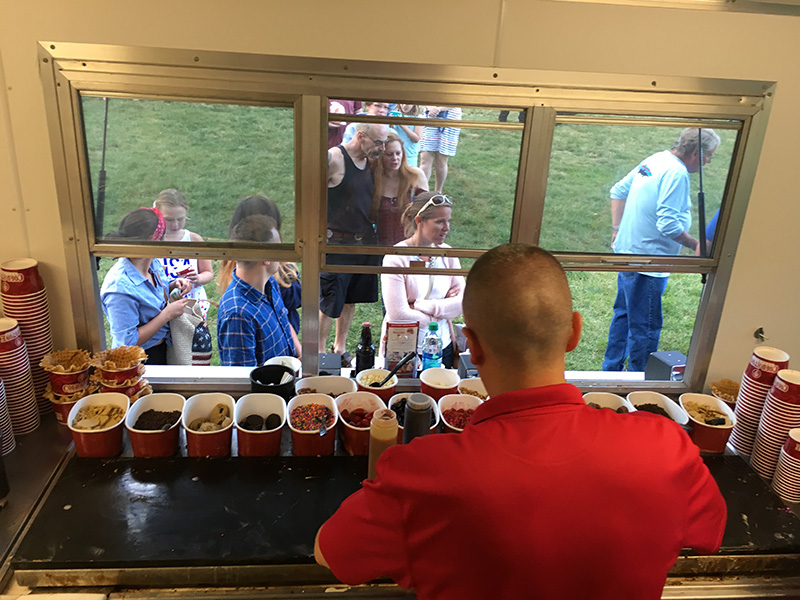 Inside Cold Stone Creamery Ice Cream Trailer Serving Guests